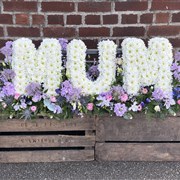 FUNERAL LETTERS ON A BED OF FLOWERS